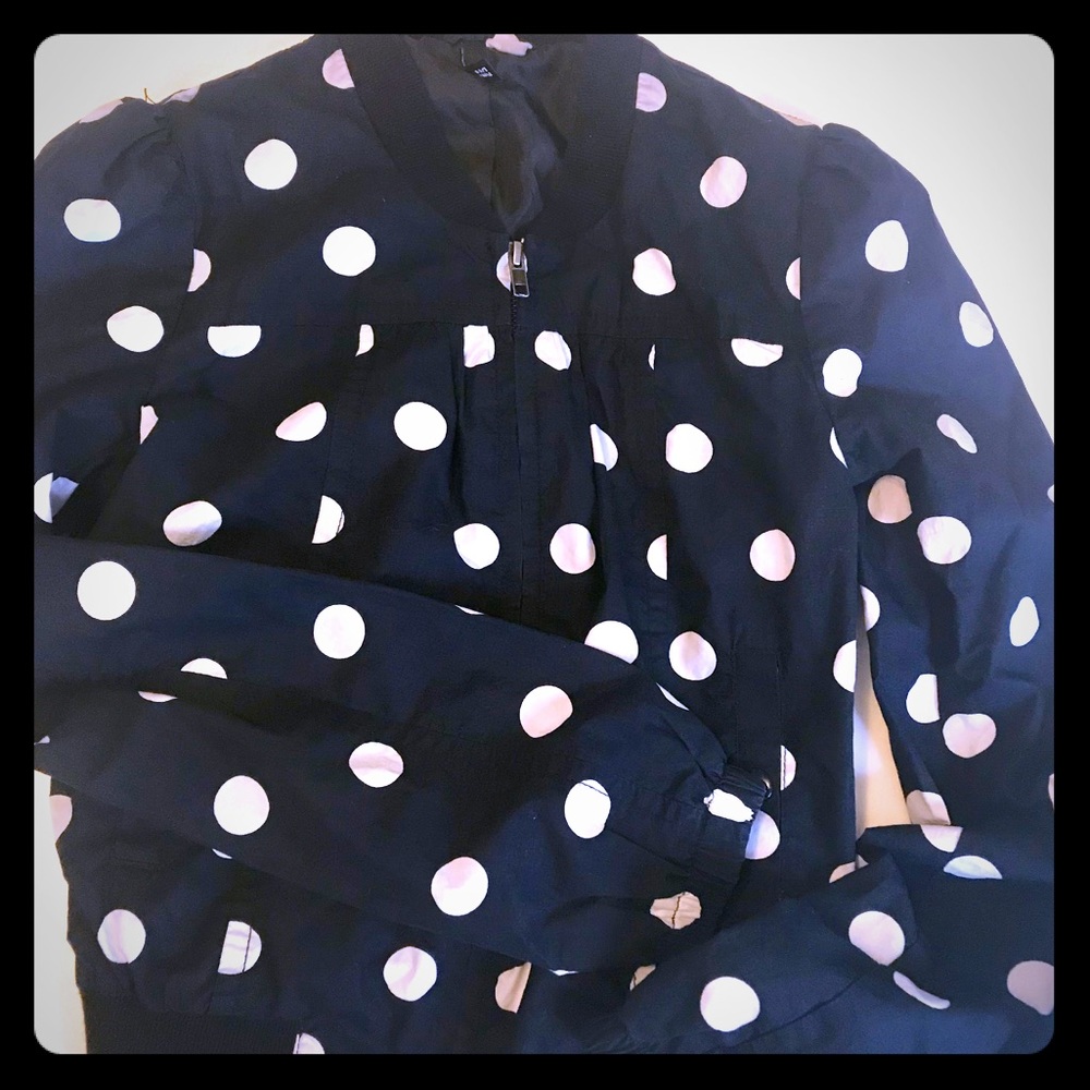 Navy blue and white polka dot spring jacket.